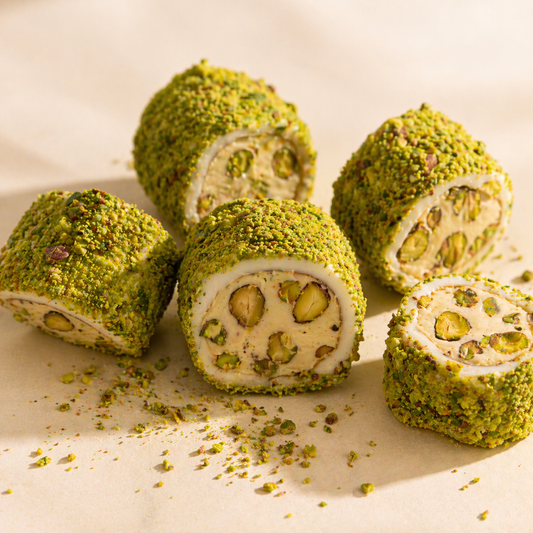 Pistachio rolls with a creamy center on a light background
