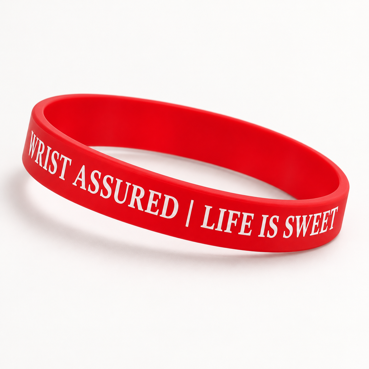 Angled view of red Wrist Assured Life Is Sweet bracelet